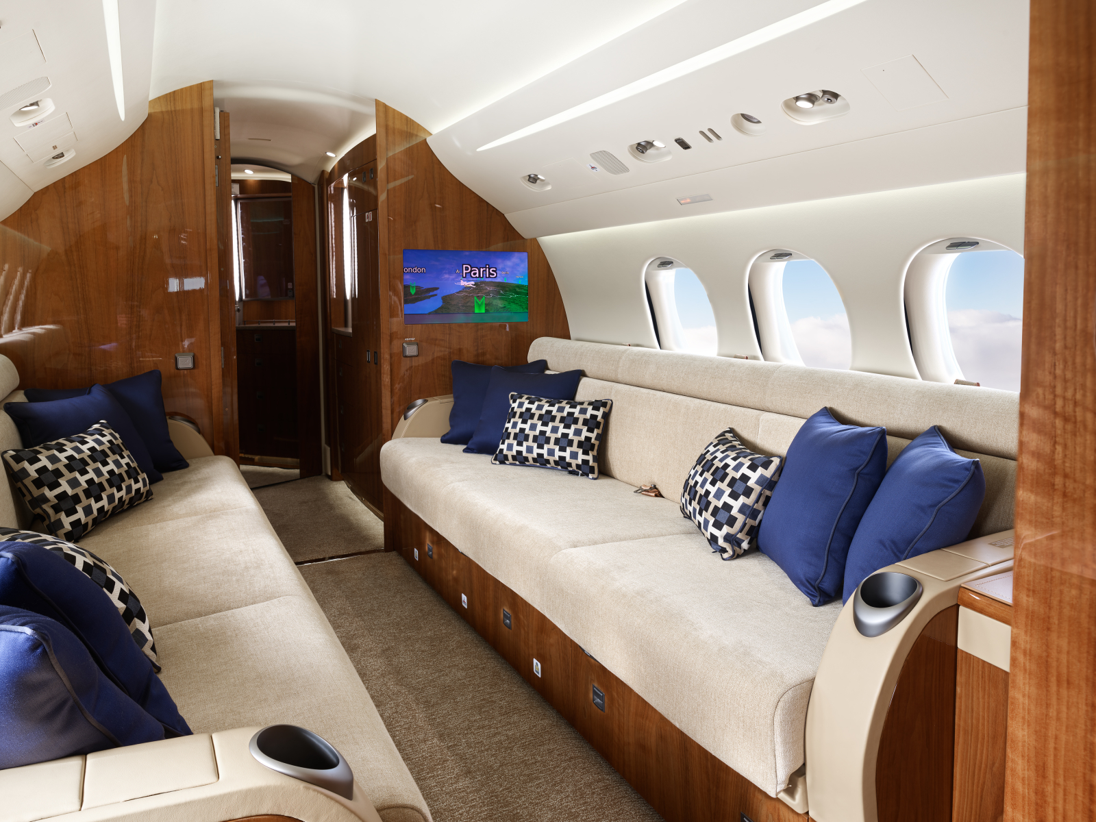 Falcon 7X PH IWS interior Couches with TV of Exxaero the Private Jet Company